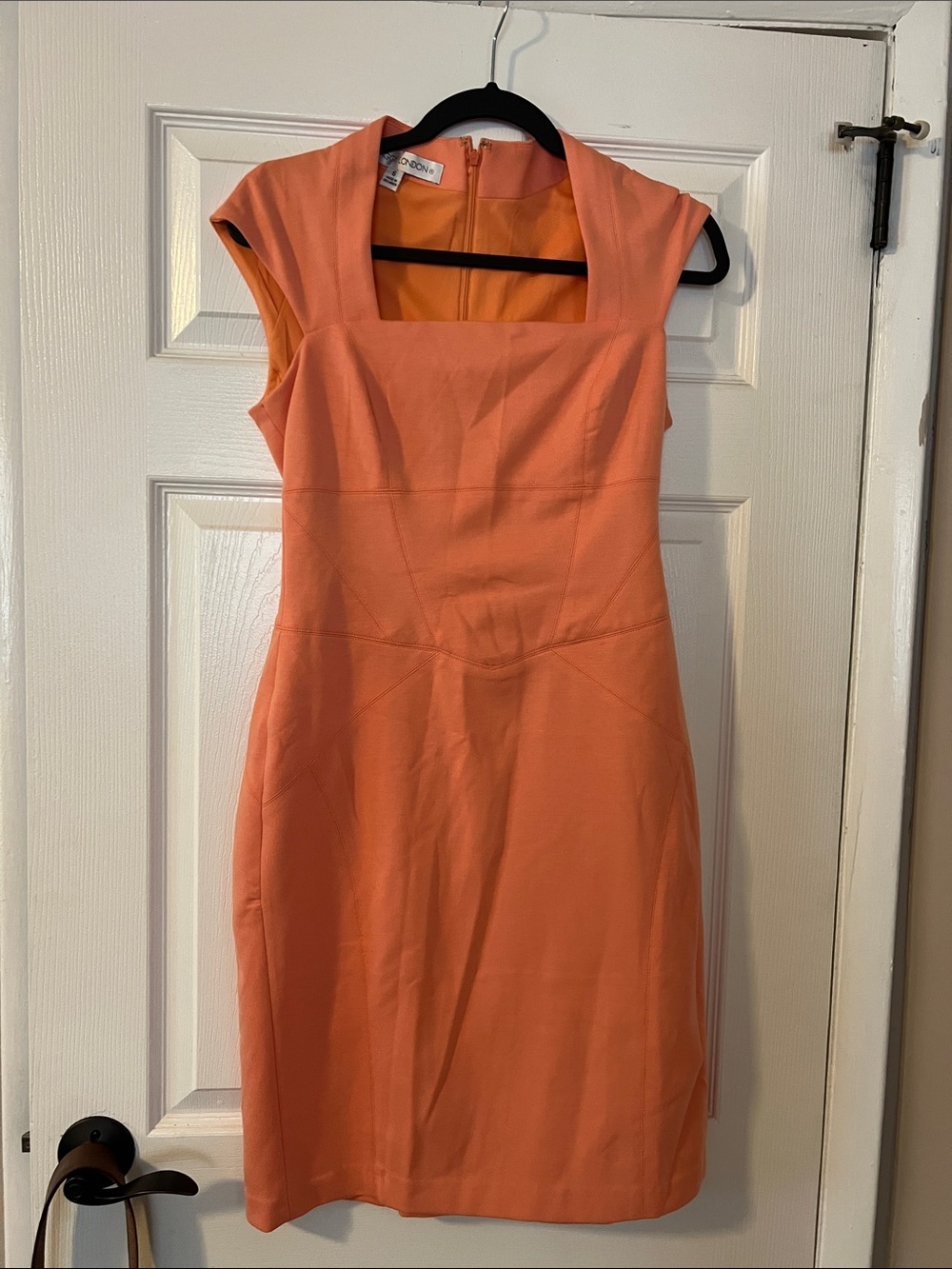 Peach dress, fitted to the knee. Size 6